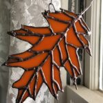 finished Oak Leaf suncatcher lit from front