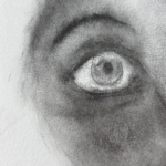 A soft edged drawing of a wide open, shiny eye gazing up toward the right with a thin, black, arched eyebrow above, a hint of the bridge of a nose and shading of the skin that fades away to the white of the page at the left